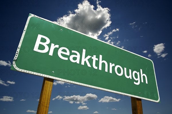 Breakthrough road sign with dramatic clouds and sky