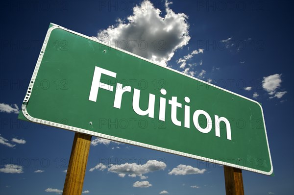 Fruition road sign with dramatic clouds and sky