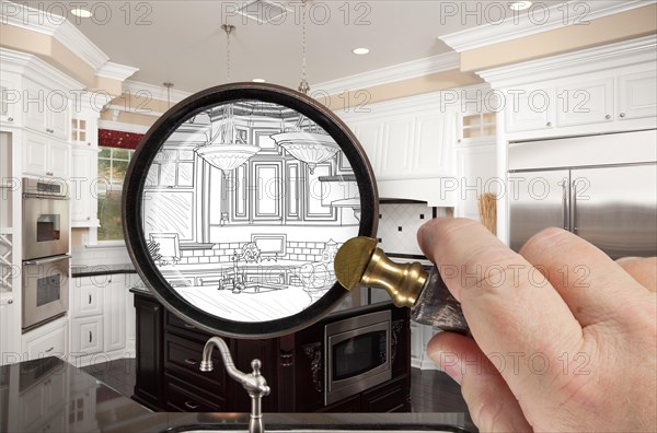 Hand holding magnifying glass revealing custom kitchen design drawing and photo combination