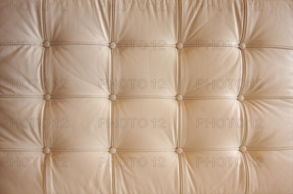 Comfortable buttoned leather pattern with dramatic lighting