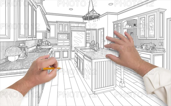 Male hands sketching with pencil the outline of a beautiful custom kitchen