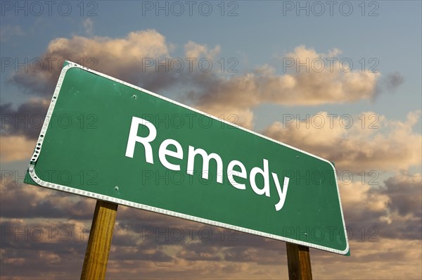 Remedy green road sign with dramatic clouds and sky