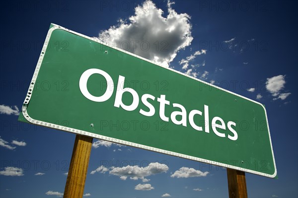 Obstacles road sign with dramatic clouds and sky