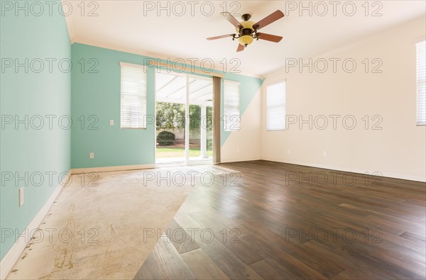 Empty room with cross section showing before and after with new wood floor and paint