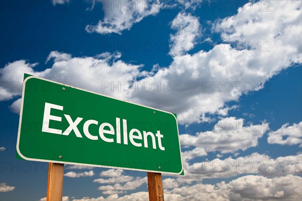 Excellent green road sign with dramatic clouds and sky