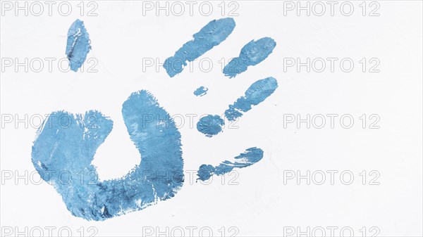Acrylic blue human palm print isolated white background