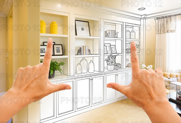 Hands framing custom built-in shelves and cabinets design drawing with section of finished photo