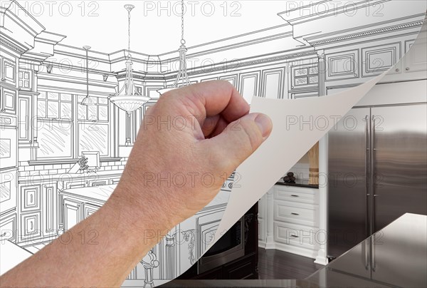 Male hand turning page of custom kitchen drawing to finished photograph underneath