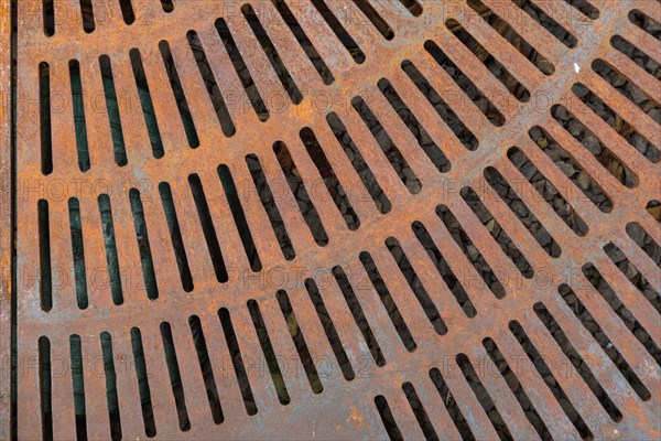 Rusty metal street grate