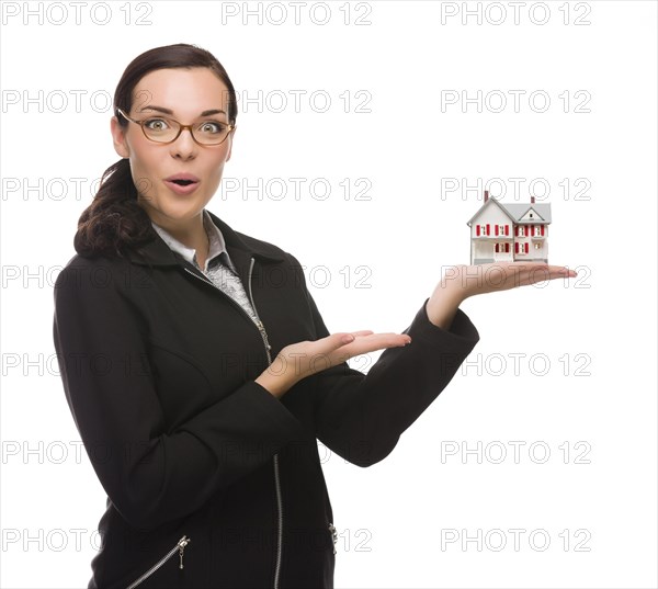 mixed-race businesswoman holding small house to the side isolated on a white background