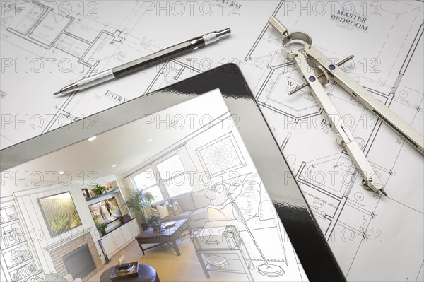 Computer tablet showing living room illustration sitting on house plans with pencil and compass