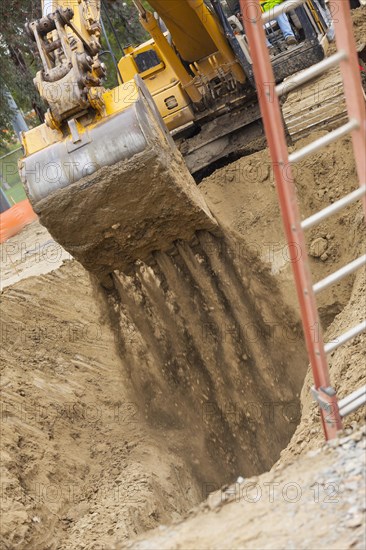 Working excavator tractor digging A trench