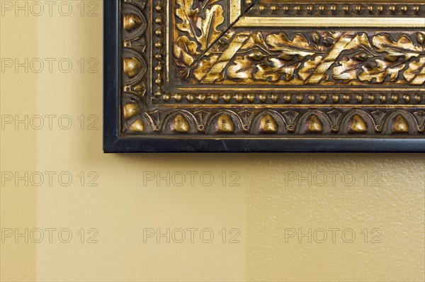 Ornate picture frame abstract on light yellow wall