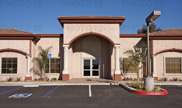 New vacant retail building and empty parking lot