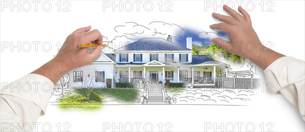 Male hands sketching with pencil the outline of a house with photo showing through