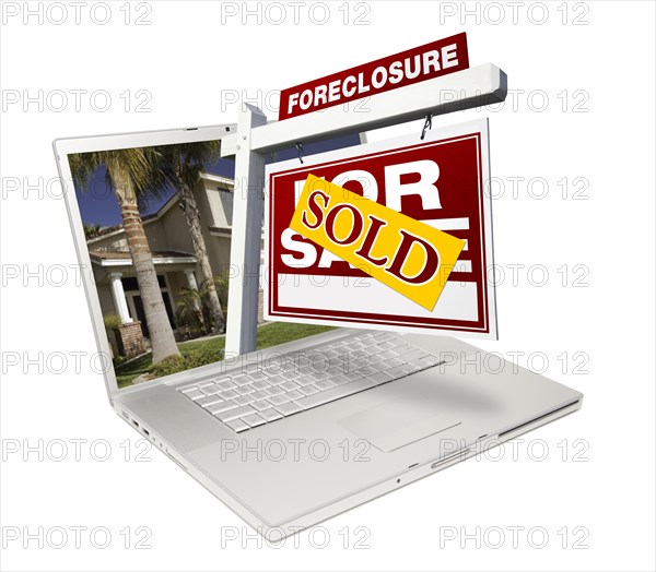 Sold foreclosure home for sale real estate sign & laptop isolated on a white background