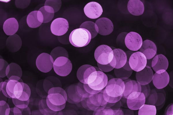 Abstract purple defocused circular light backdrop