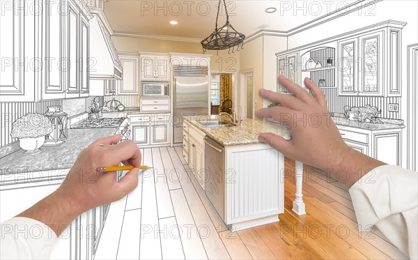 Male hands sketching with pencil A custom kitchen with photo showing through