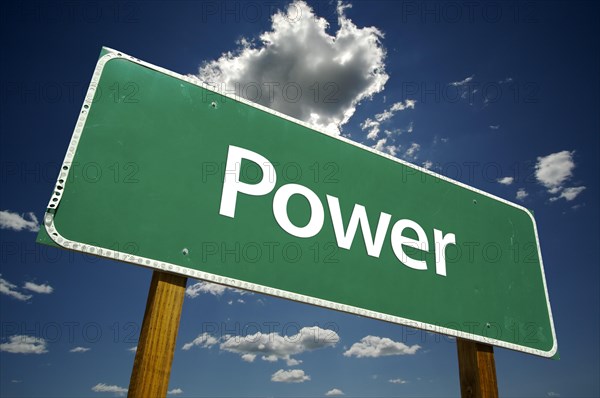 Power road sign with dramatic clouds and sky