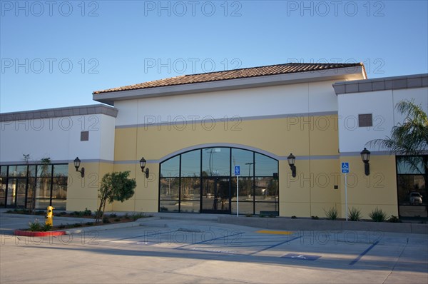 New vacant retail building & parking spaces