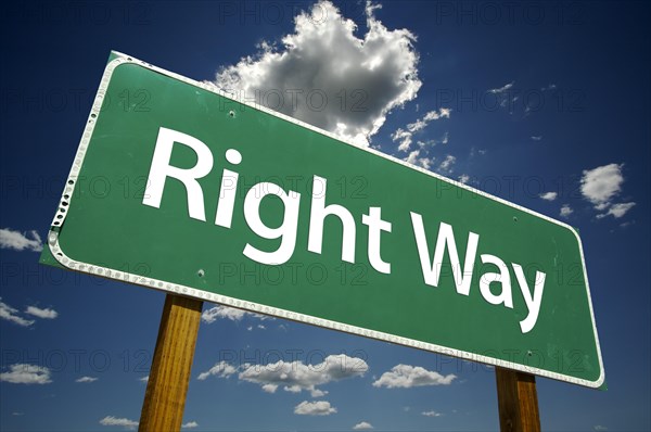 Right way road sign with dramatic clouds and sky