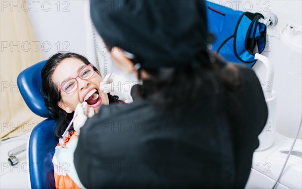 Top view of dentist doing dental checkup