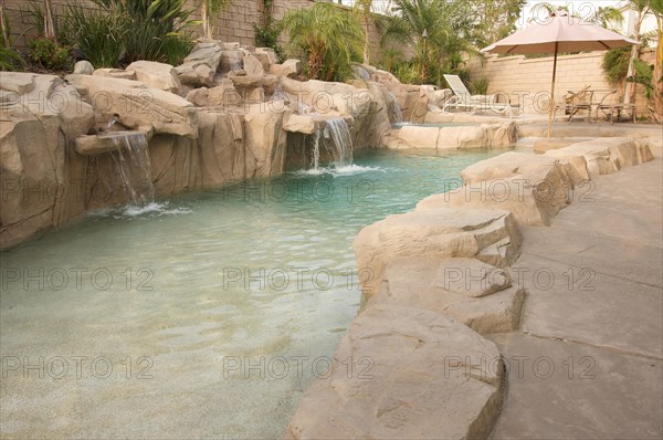 Tropical custom pool with waterfalls