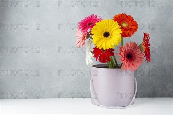Arrangement gerbera daisy flowers bucket