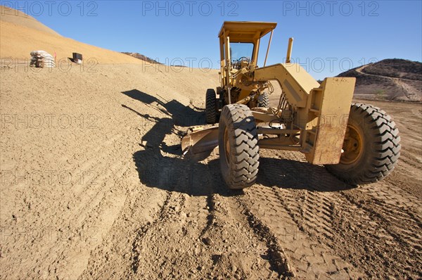 Tractor at a construction site and dirt lot