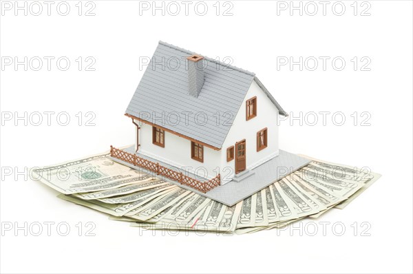 Home and money isolated on a white background