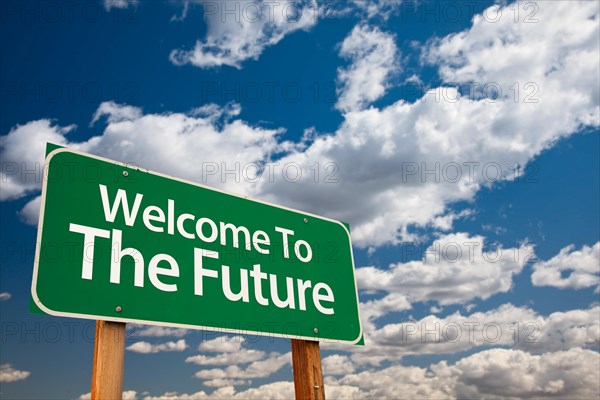 Welcome to the future green road sign with copy room over the dramatic clouds and sky