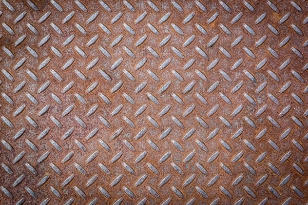 Rusty vignetted metal texture background