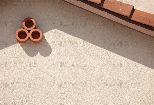 Abstract of new stucco wall and roof from house