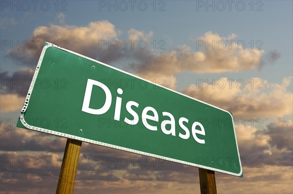 Disease green road sign with dramatic clouds and sky