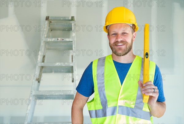 Caucasian male contractor with hard hat