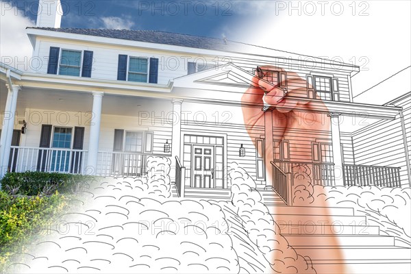 Male hand sketching with pencil the outline of a house with photo showing through