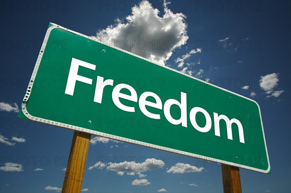 Freedom road sign with dramatic clouds and sky