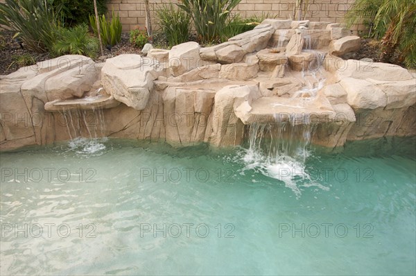 Tropical custom pool with waterfalls