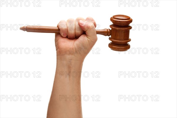 Man holding wooden gavel in his fist isolated on a white background