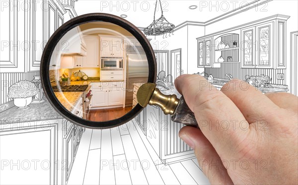 Hand holding magnifying glass revealing custom kitchen design drawing and photo combination