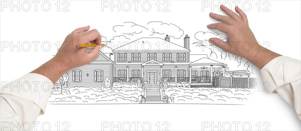 Male hands sketching with pencil the outline of a beautiful house on white