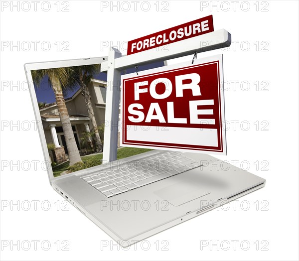 Foreclosure home for sale real estate sign & laptop isolated on a white background