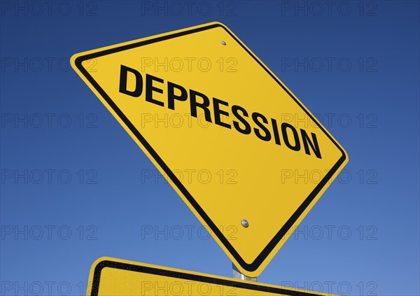 Depression yellow road sign against a deep blue sky with clipping path