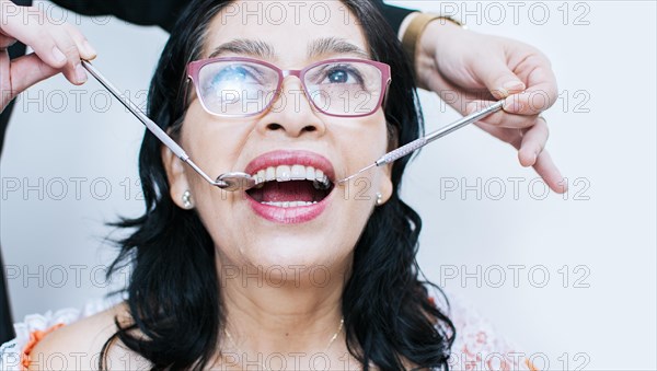 Close up of dentist with patient