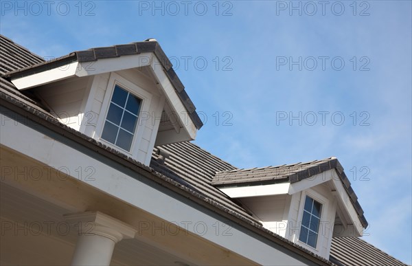 Abstract house facade against a blue sky