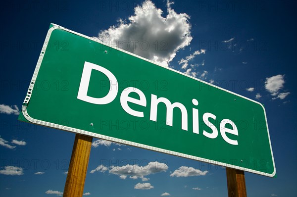 Demise green road sign with dramatic clouds and sky