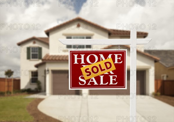 Sold home for sale real estate sign in front of new house