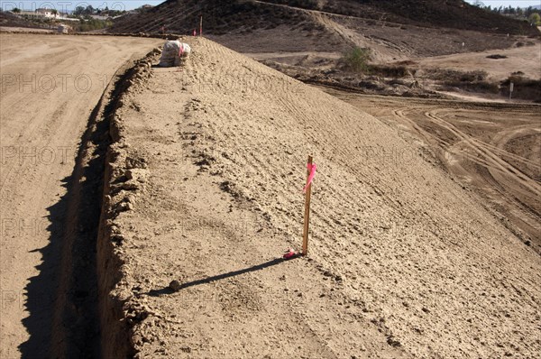 Sandbags & marker sticks at construction site