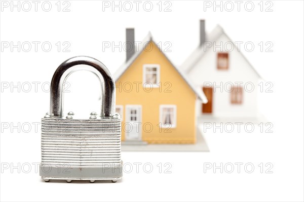 Lock and houses isolated on a white background