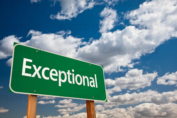 Exceptional green road sign with dramatic clouds and sky